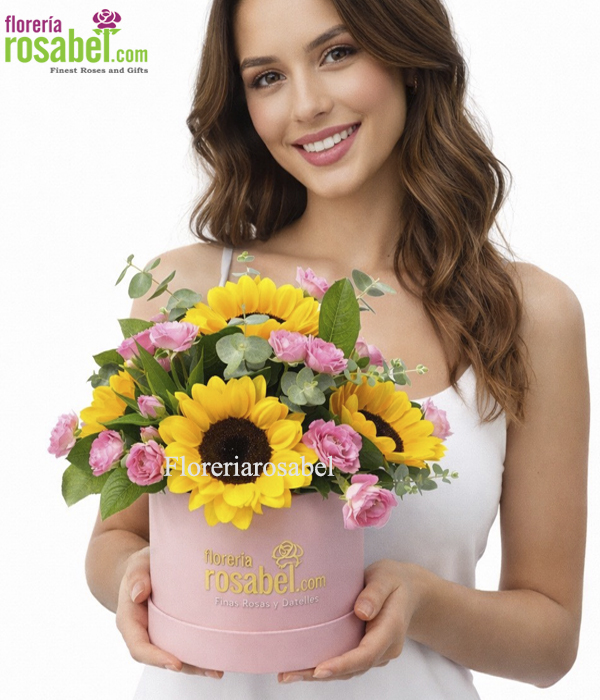 Arreglos en caja rosada con girasoles, elegancia de las flores amarillas en box